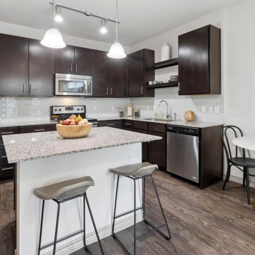 a kitchen with a table and chairs