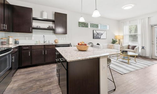 a kitchen with a granite island