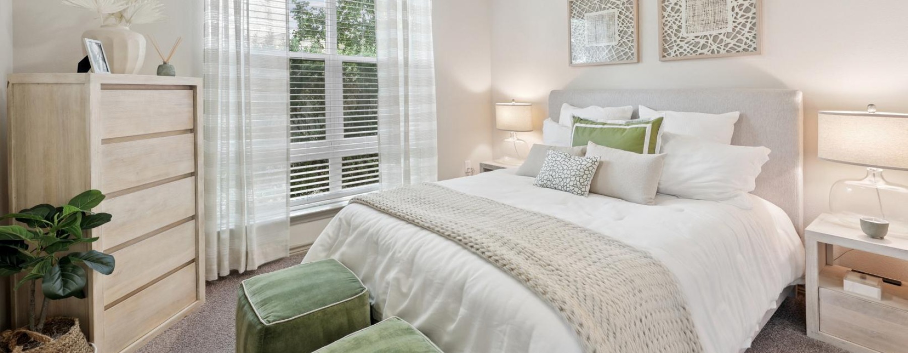 a bedroom with a bed and a fan